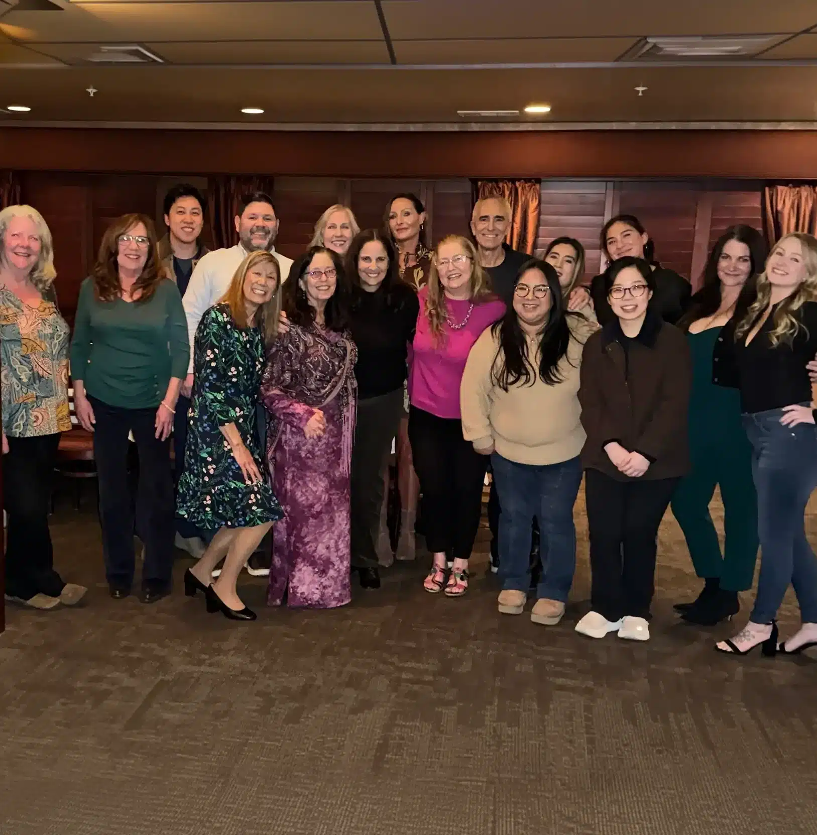 Large group of women posing together indoors at Roots & Gums of the Tri Valley event or gathering.