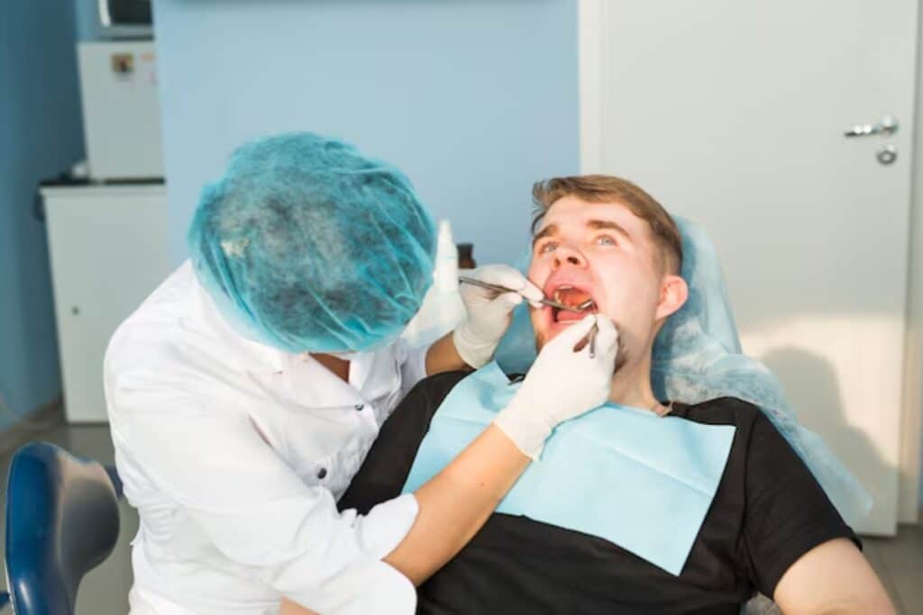 Dentist examining an oral cancer Patient