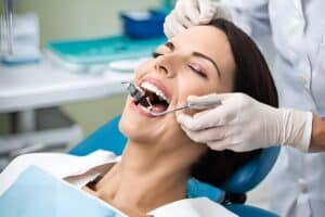 Periodontist performing crown lengthening